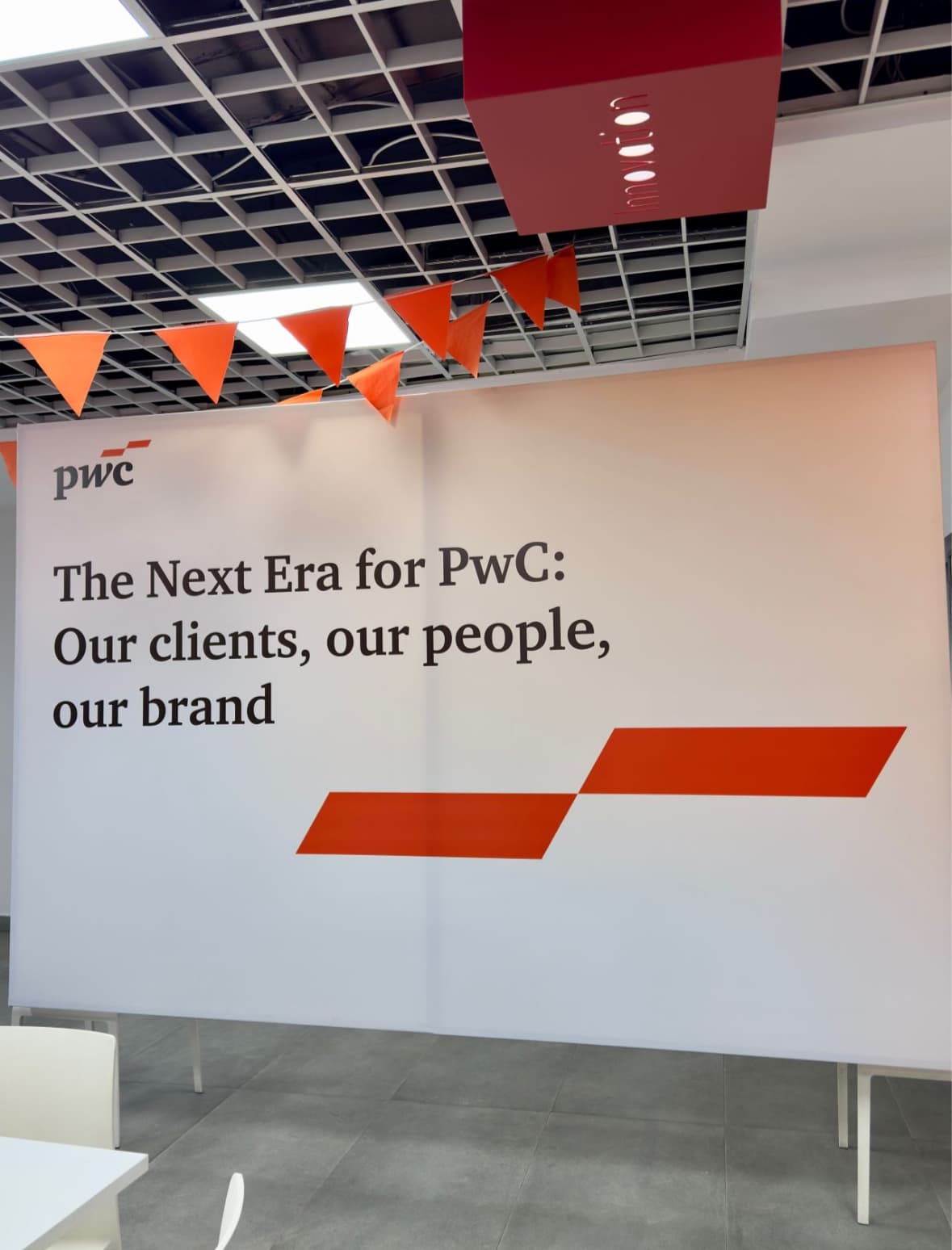 PwC office banner: “The Next Era for PwC”