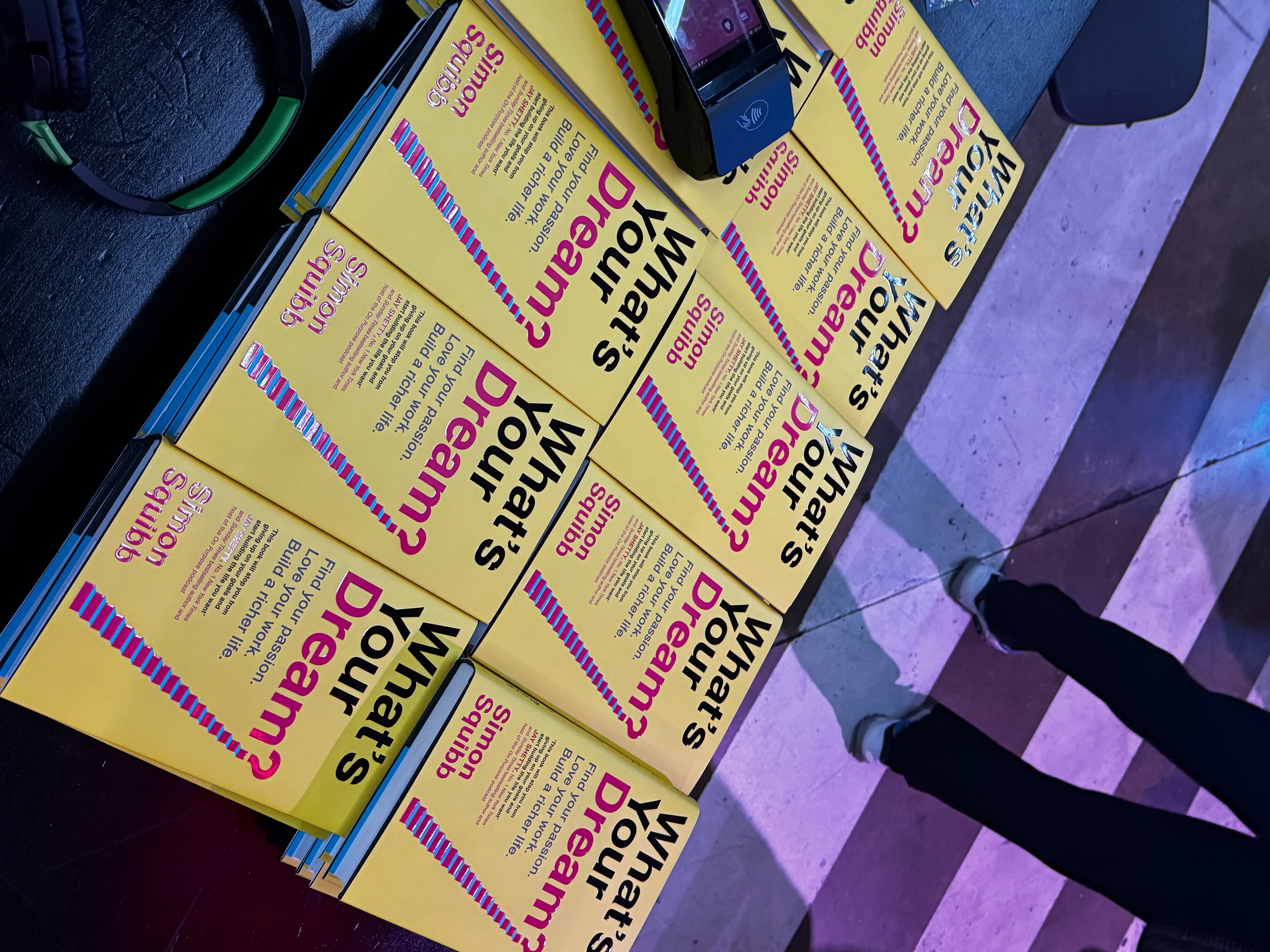 Stack of Simon Squibb's book “What's Your Dream?” at the event